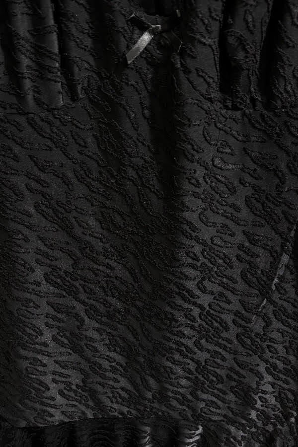 HALTER DRESS WITH ASYMMETRICAL SKIRT