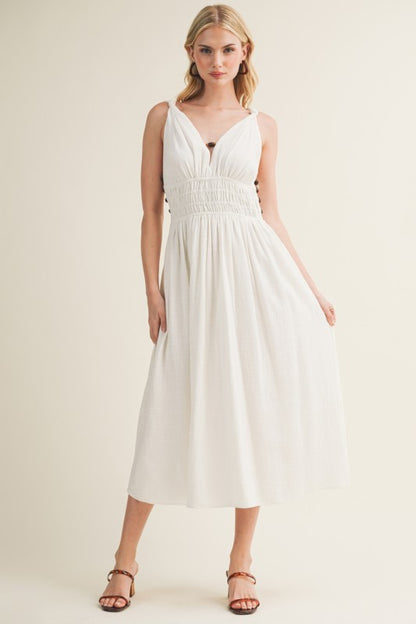SLEEVELESS SIDE BUTTON SMOCKED WAIST MIDI DRESS WITH BEAD DETAIL