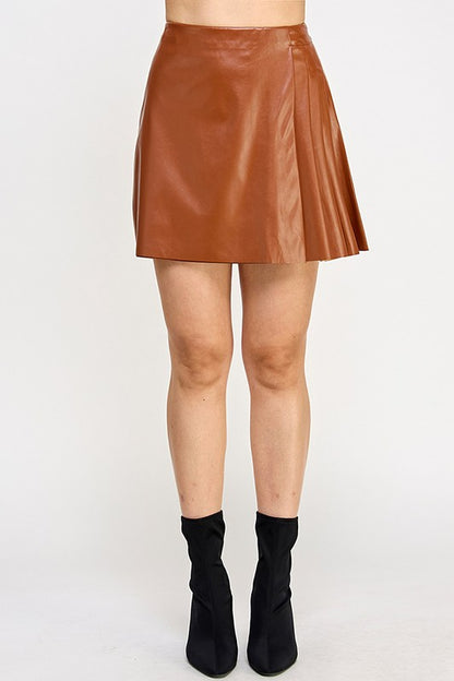 FAUX LEATHER ASYMMETRIC PLEATED MINI SKIRT