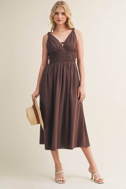 SLEEVELESS SIDE BUTTON SMOCKED WAIST MIDI DRESS WITH BEAD DETAIL