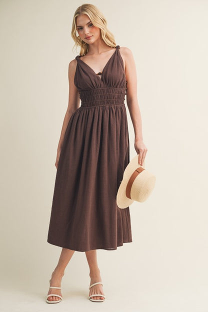 SLEEVELESS SIDE BUTTON SMOCKED WAIST MIDI DRESS WITH BEAD DETAIL