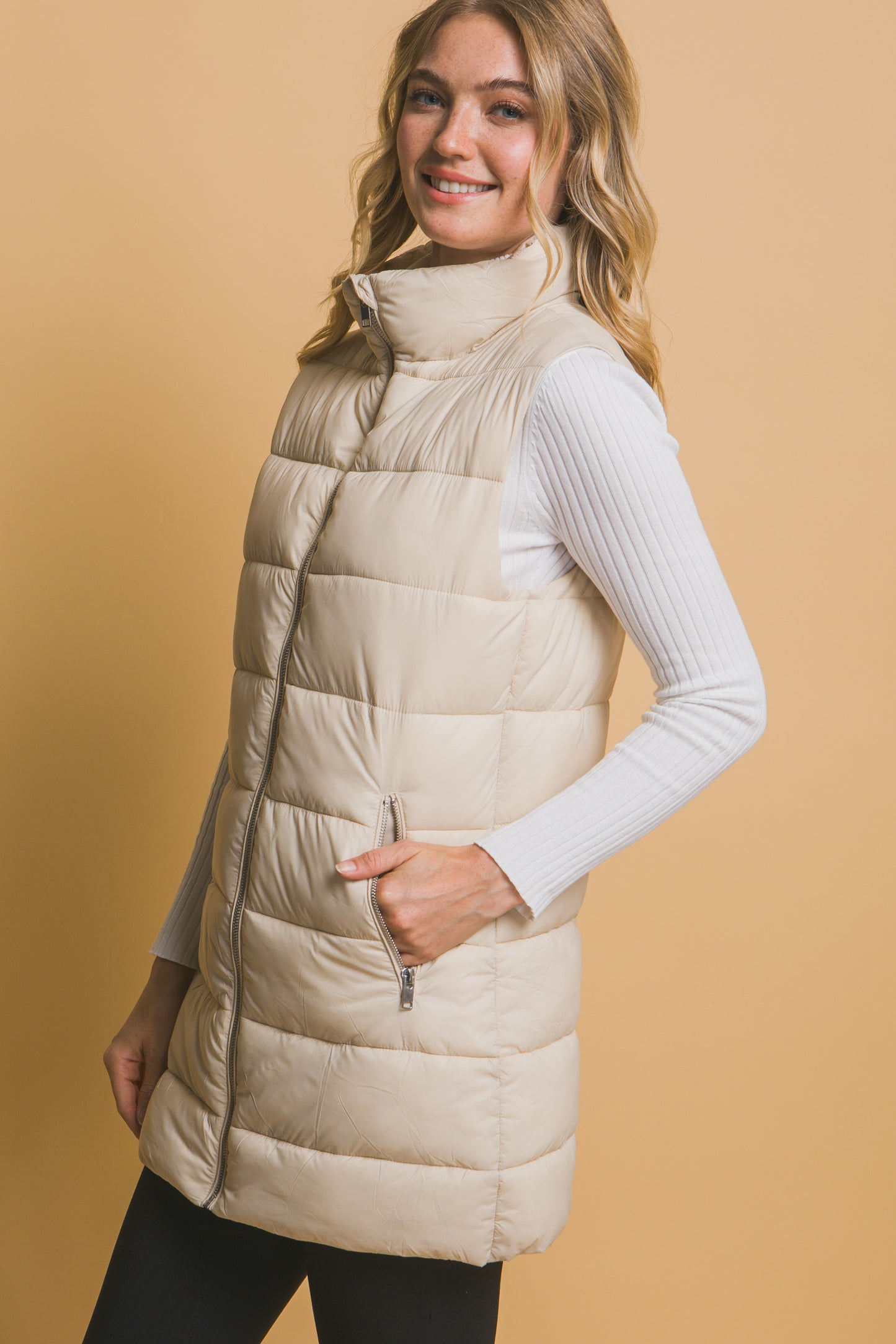 SLEEVLESS PUFFER VVEST WITH POCKETS