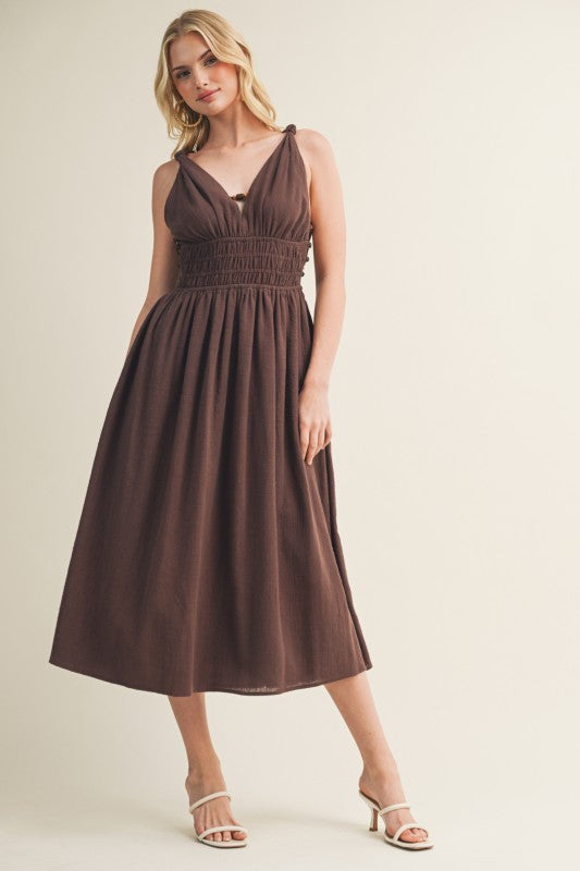 SLEEVELESS SIDE BUTTON SMOCKED WAIST MIDI DRESS WITH BEAD DETAIL