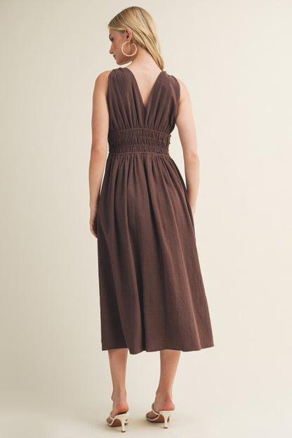 SLEEVELESS SIDE BUTTON SMOCKED WAIST MIDI DRESS WITH BEAD DETAIL