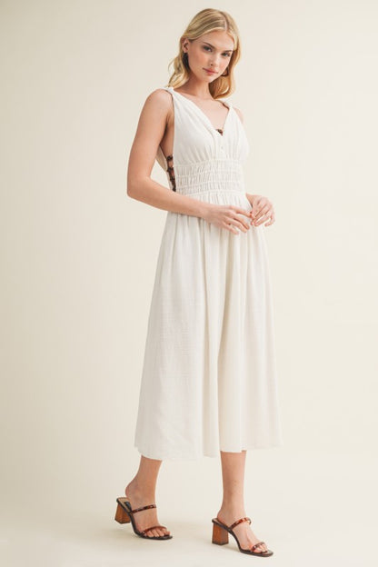 SLEEVELESS SIDE BUTTON SMOCKED WAIST MIDI DRESS WITH BEAD DETAIL