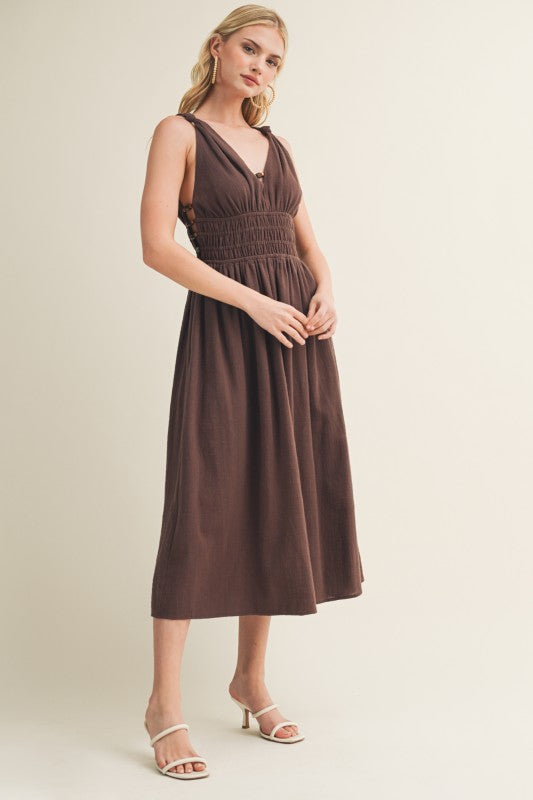 SLEEVELESS SIDE BUTTON SMOCKED WAIST MIDI DRESS WITH BEAD DETAIL