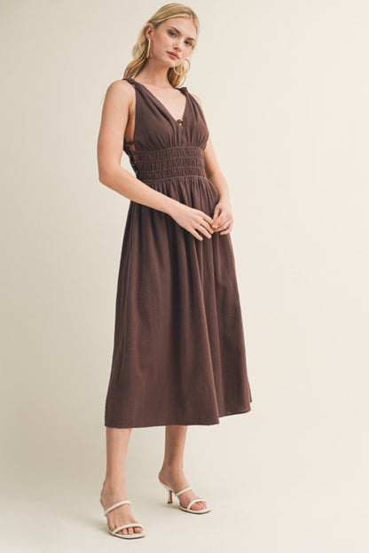 SLEEVELESS SIDE BUTTON SMOCKED WAIST MIDI DRESS WITH BEAD DETAIL